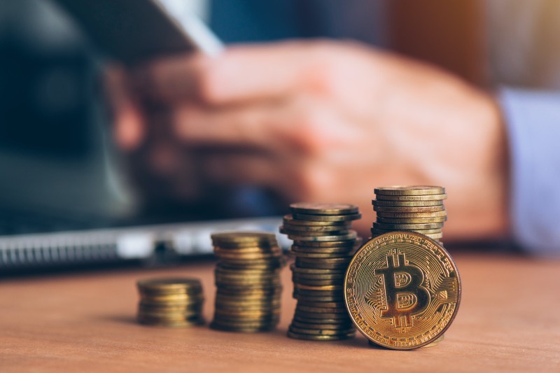 Person trading bitcoin on phone